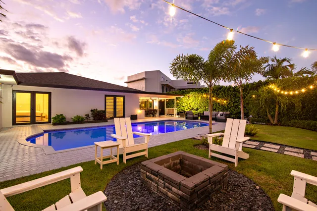 a view of a patio with chairs and tables