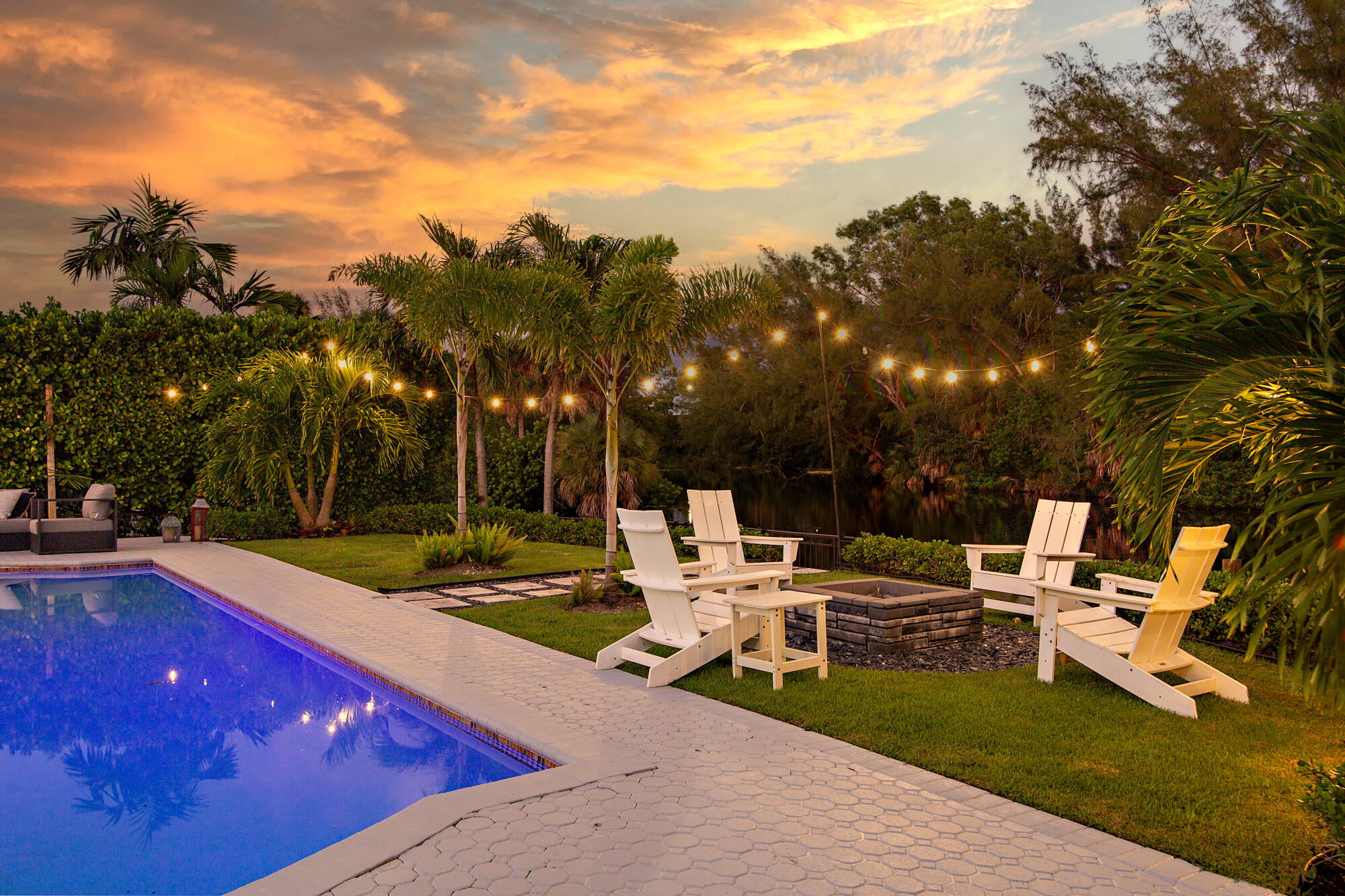 7730 Beta Circle Lake Clarke Shores, FL 33406 - Photo 25 of 50 a view of a patio with chairs and tables