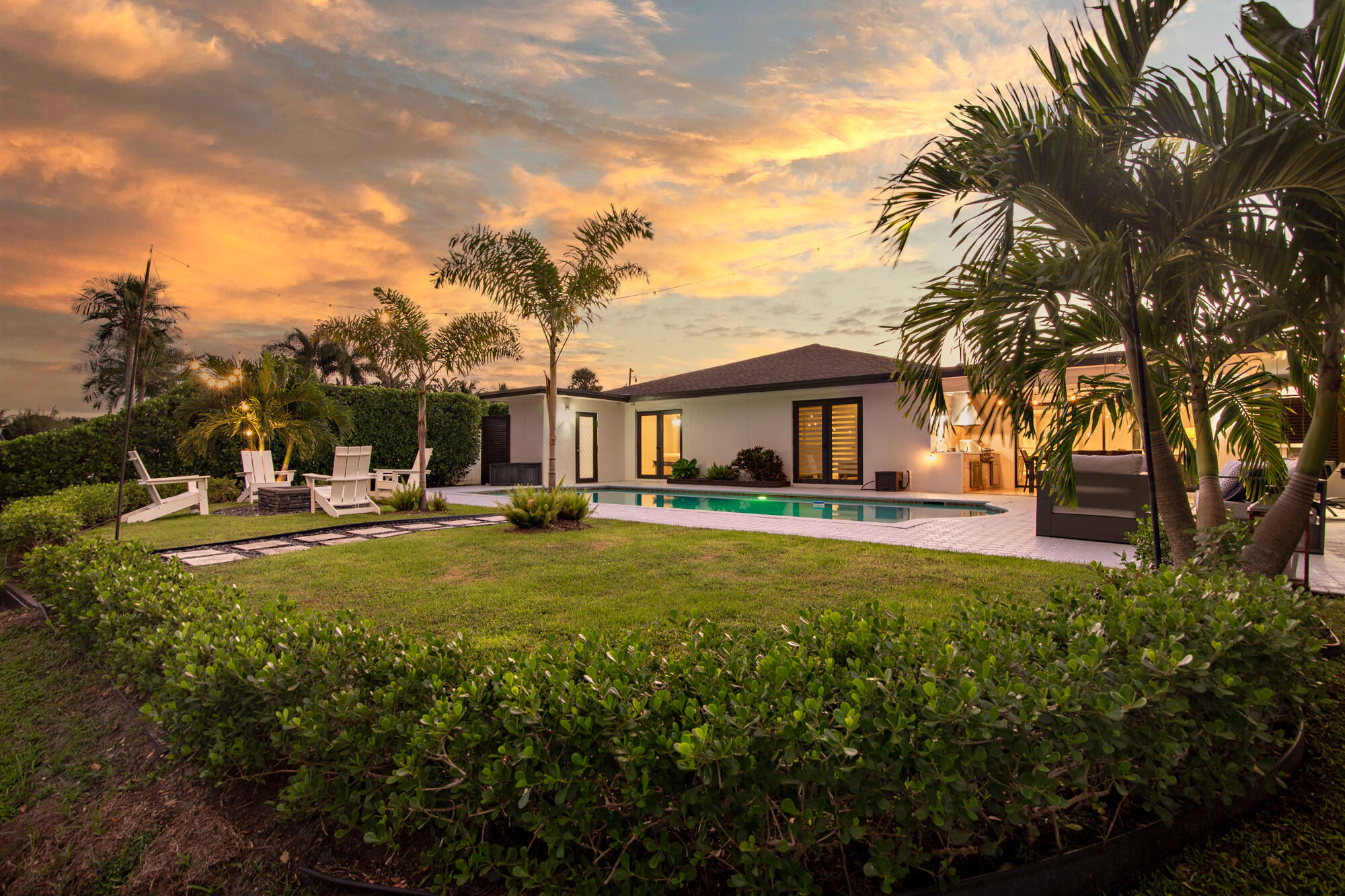 7730 Beta Circle Lake Clarke Shores, FL 33406 - Photo 26 of 50 a view of an house with backyard space and garden