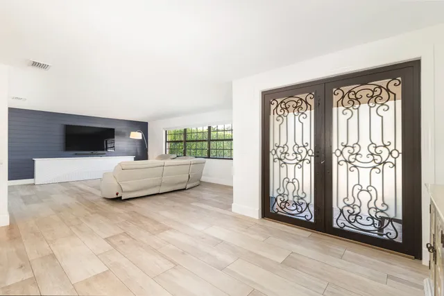 a living room with a couch and a flat screen tv