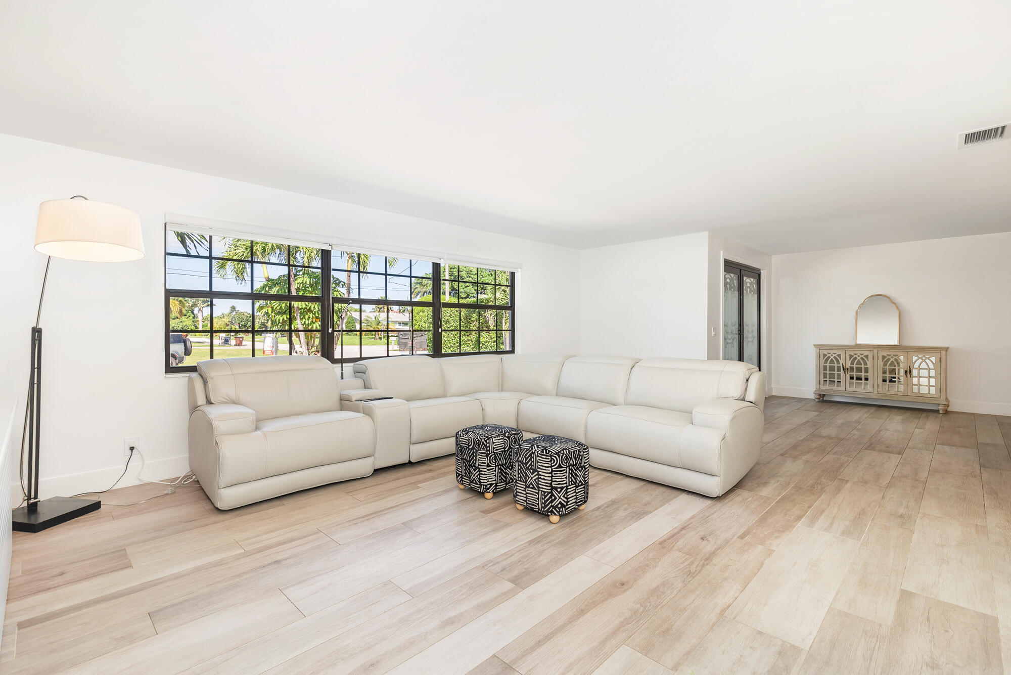 7730 Beta Circle Lake Clarke Shores, FL 33406 - Photo 30 of 50 a living room with furniture and a window
