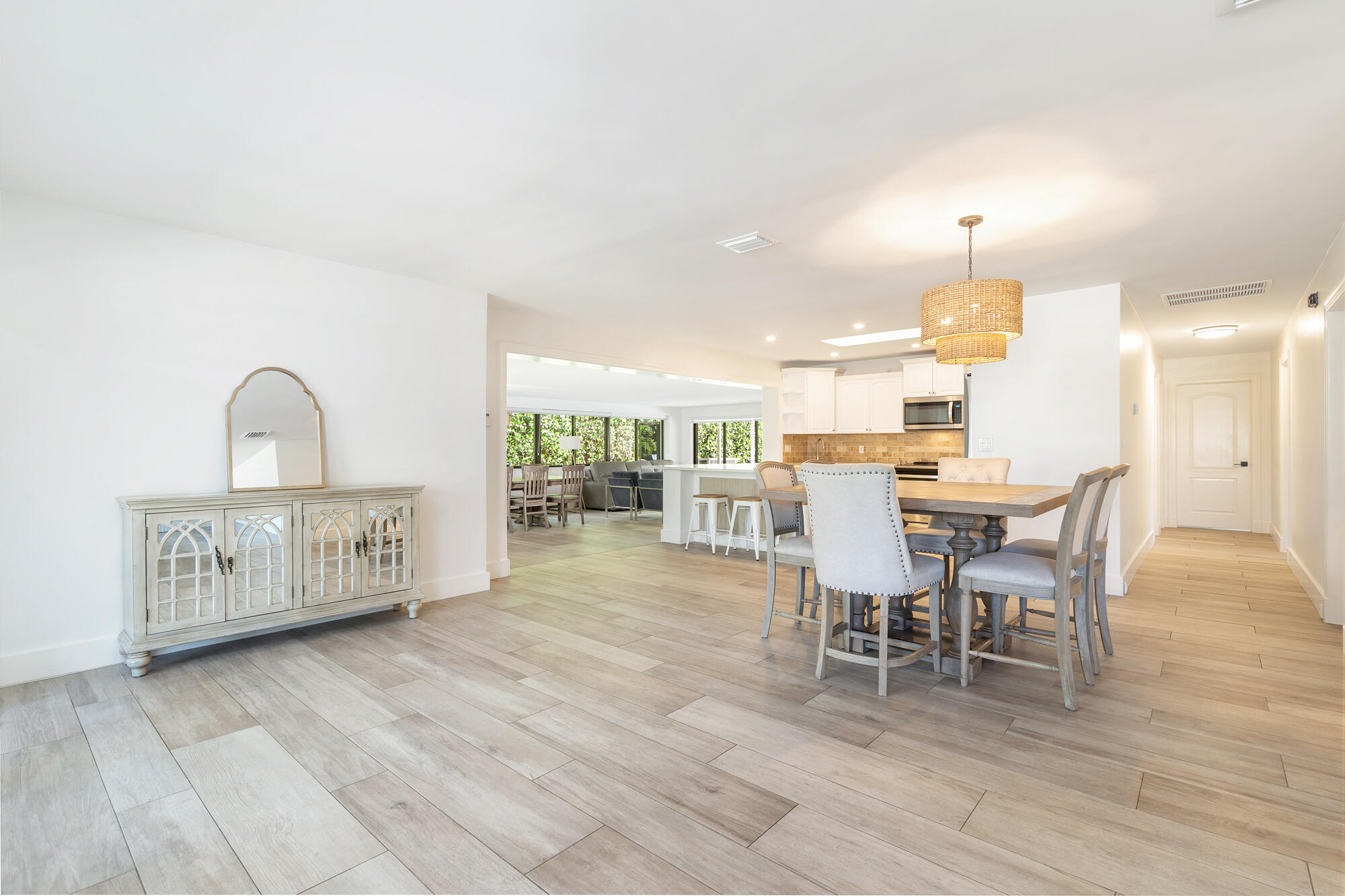 7730 Beta Circle Lake Clarke Shores, FL 33406 - Photo 31 of 50 a view of a dining room with furniture window and wooden floor