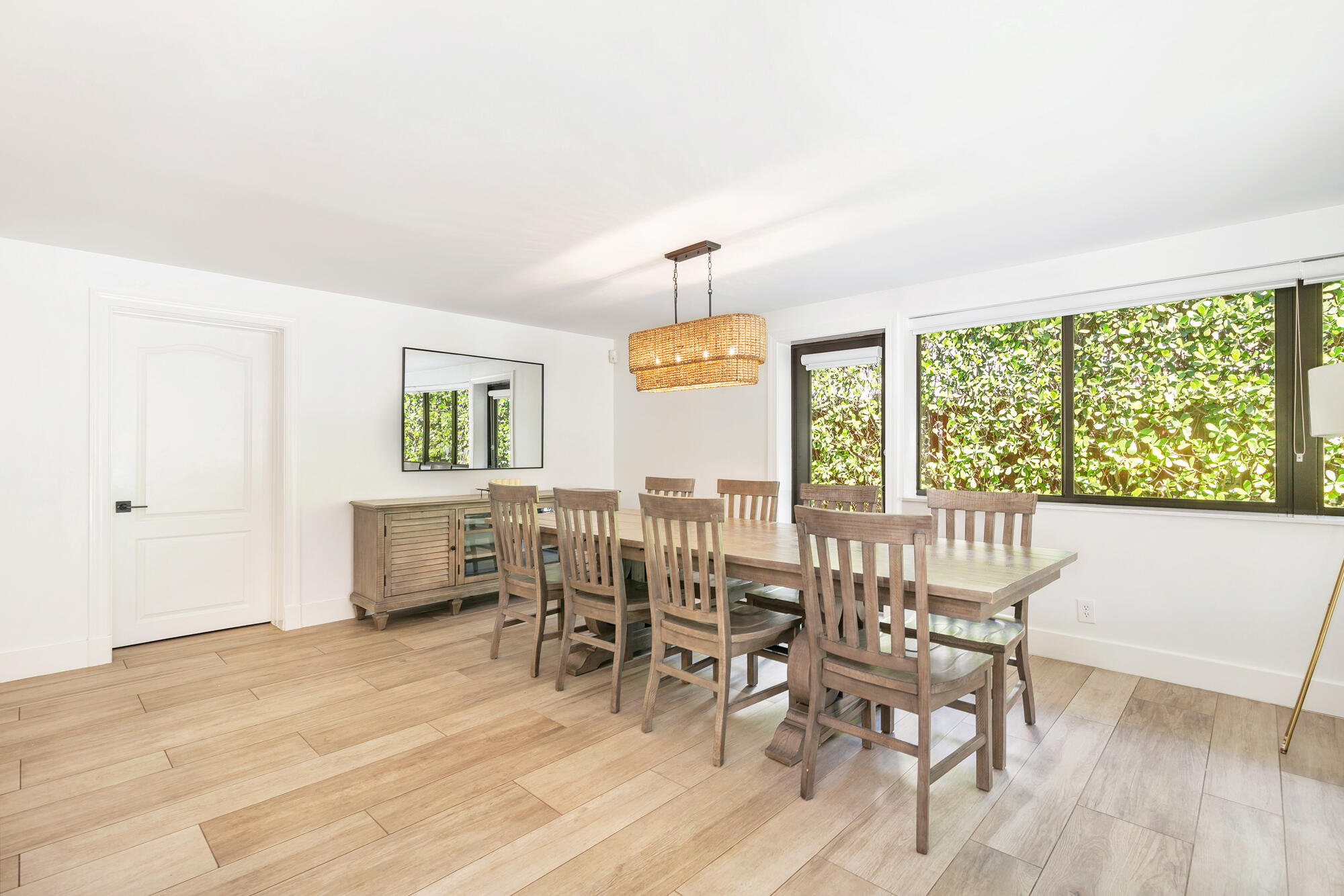 7730 Beta Circle Lake Clarke Shores, FL 33406 - Photo 36 of 50 a view of a dining room with furniture window and wooden floor