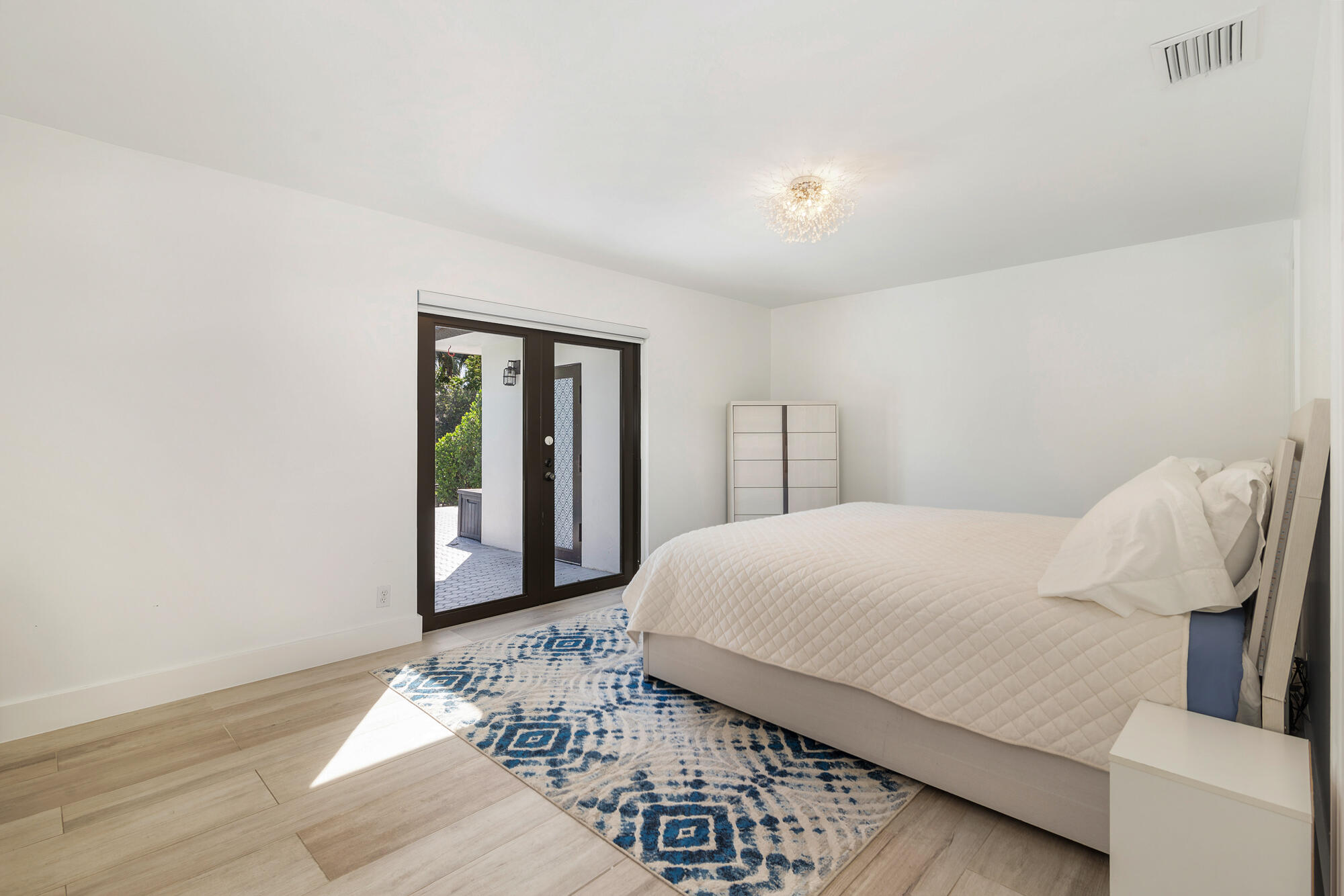 7730 Beta Circle Lake Clarke Shores, FL 33406 - Photo 39 of 50 a bedroom with a bed and window