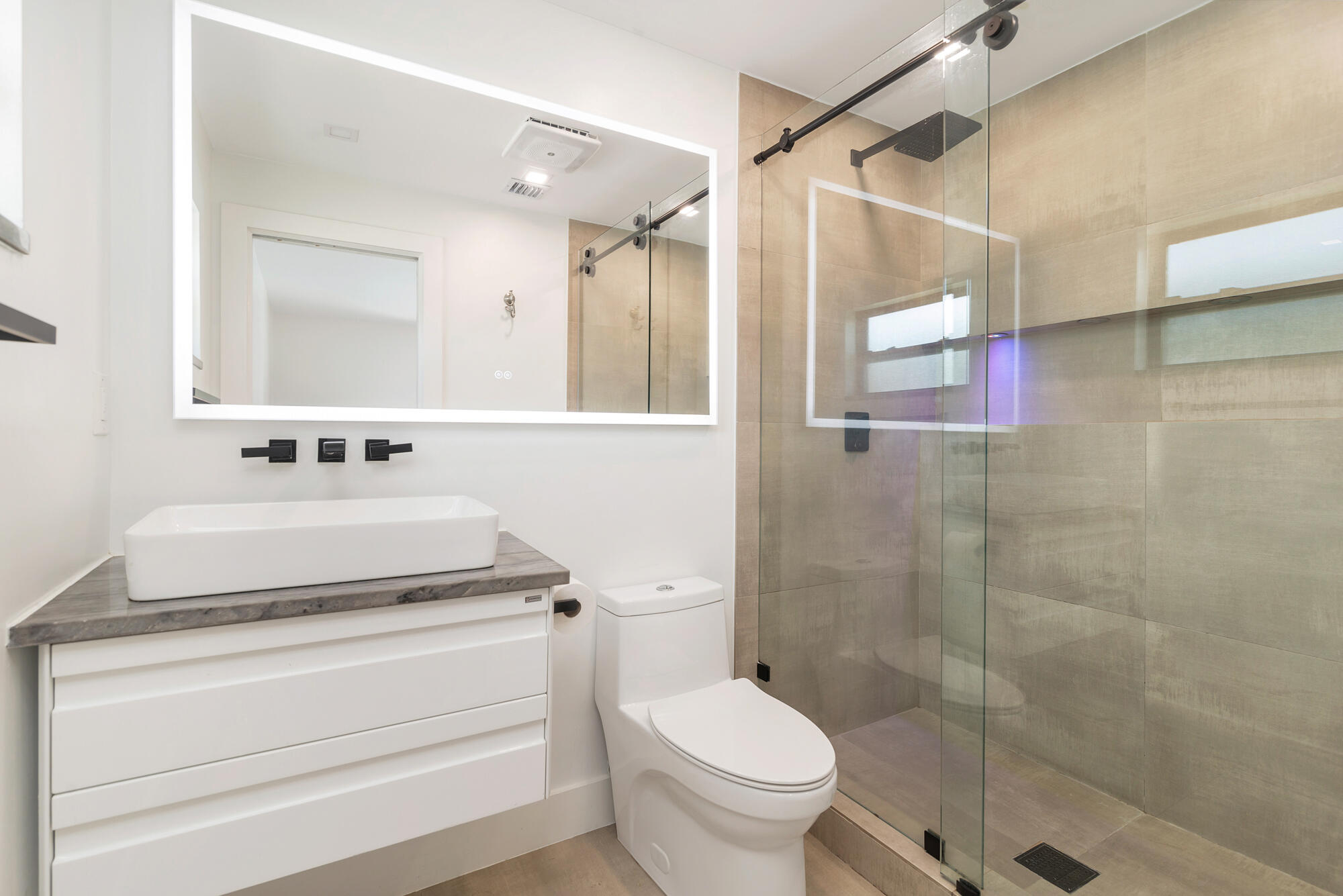 7730 Beta Circle Lake Clarke Shores, FL 33406 - Photo 41 of 50 a bathroom with a sink toilet and shower