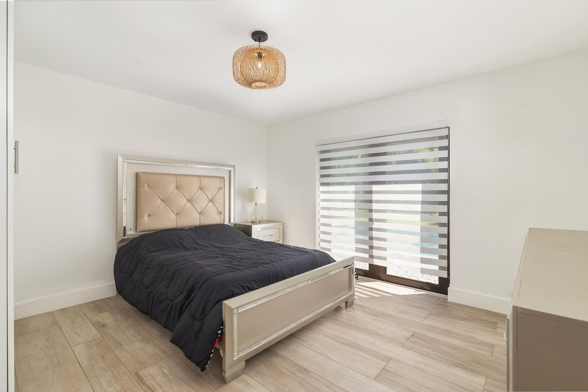 7730 Beta Circle Lake Clarke Shores, FL 33406 - Photo 42 of 50 a spacious bedroom with a bed and a window