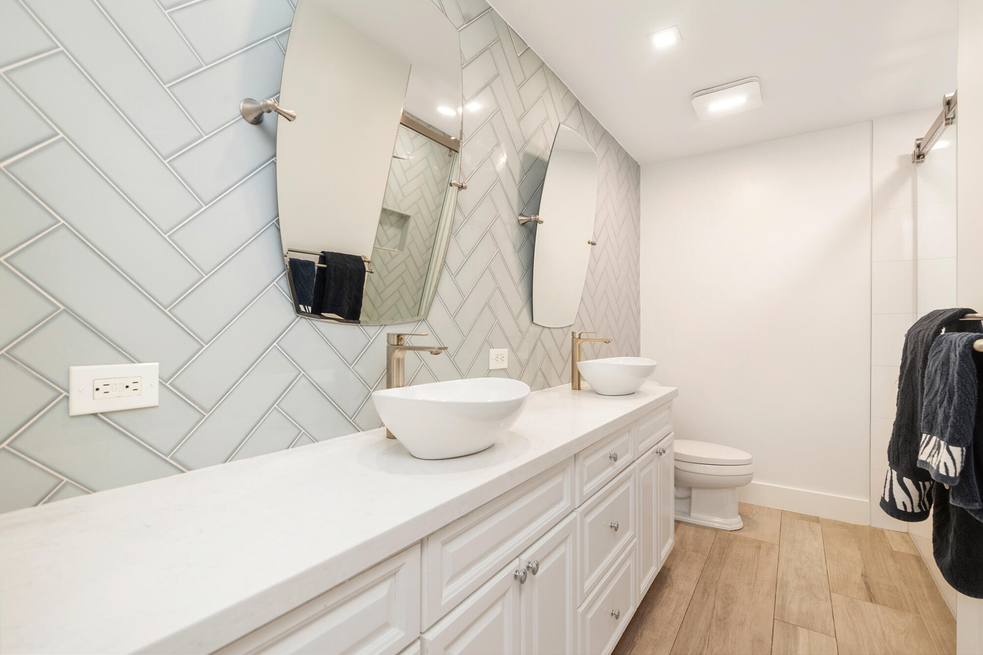 7730 Beta Circle Lake Clarke Shores, FL 33406 - Photo 43 of 50 a bathroom with a sink a toilet and shower