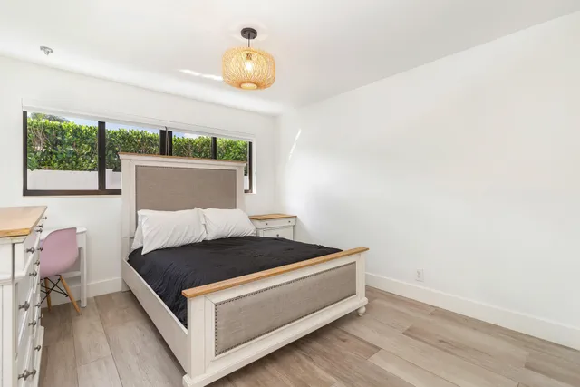 a view of a room with a table and chairs