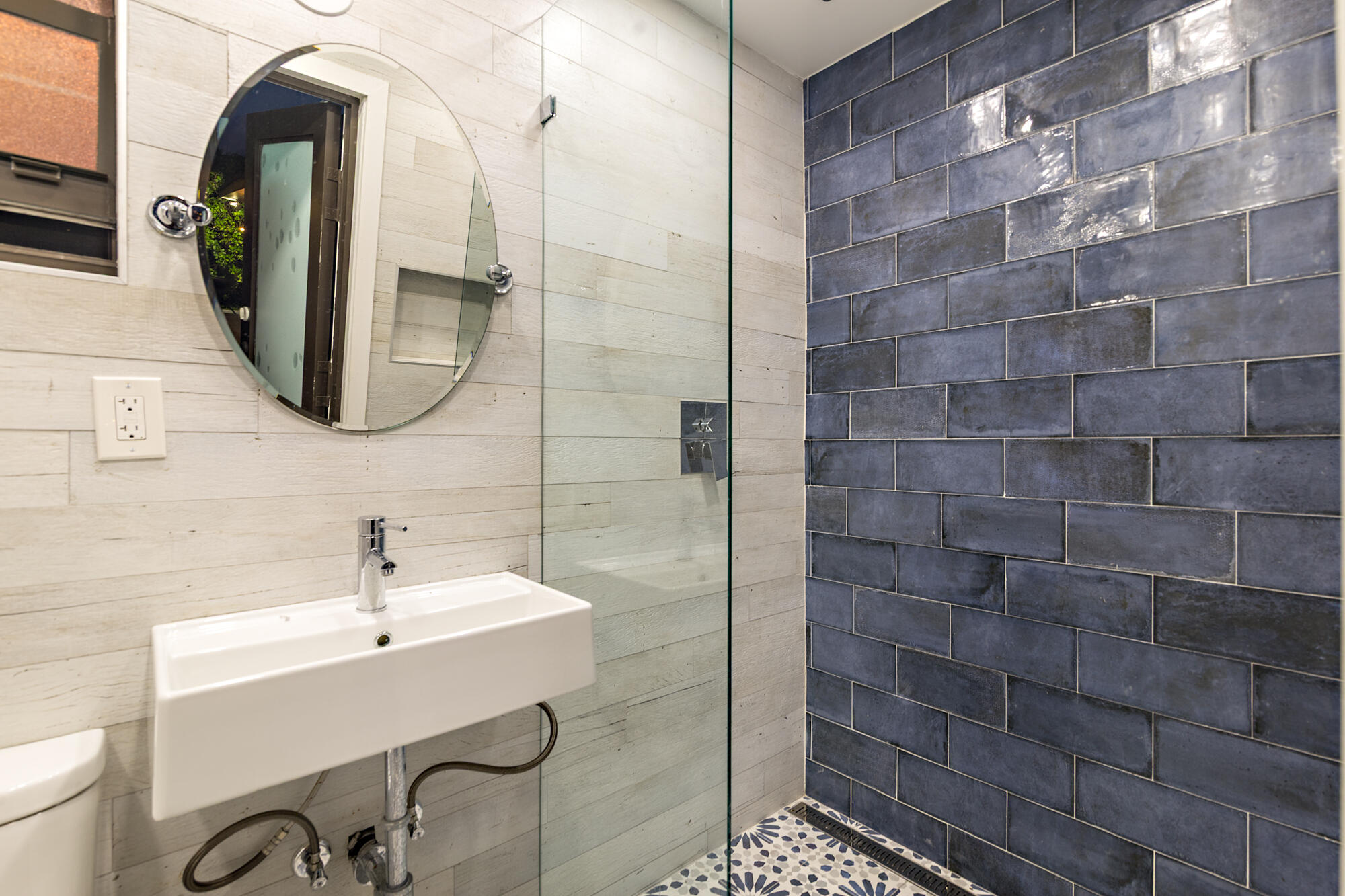 7730 Beta Circle Lake Clarke Shores, FL 33406 - Photo 46 of 50 a bathroom with a sink and a mirror