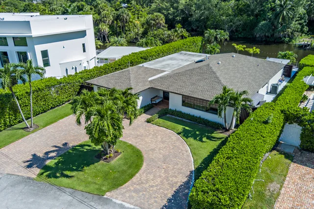 an aerial view of a house with a yard and a garden