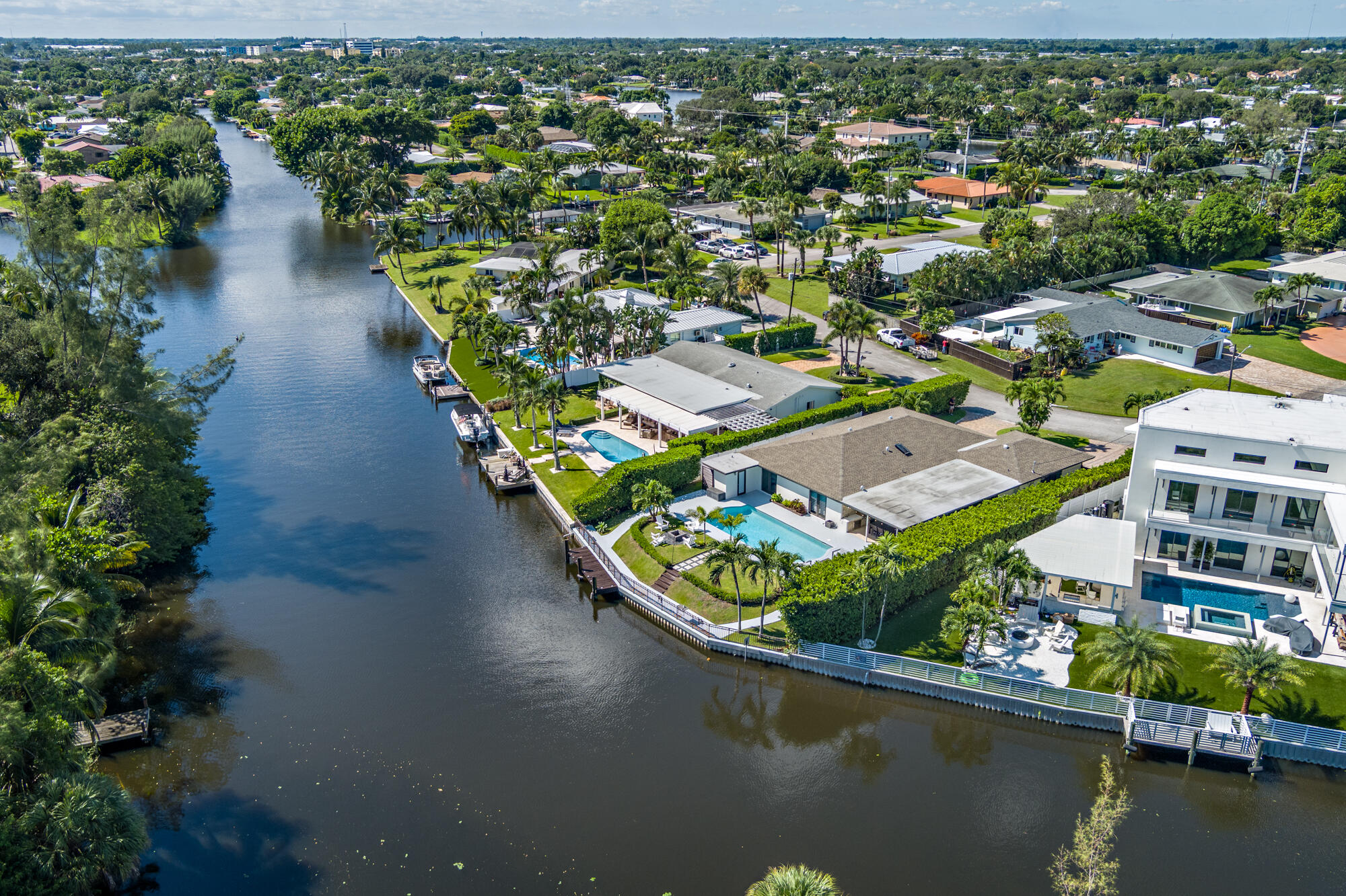7730 Beta Circle Lake Clarke Shores, FL 33406 - Photo 5 of 50 an aerial view of residential houses with outdoor space and lake view