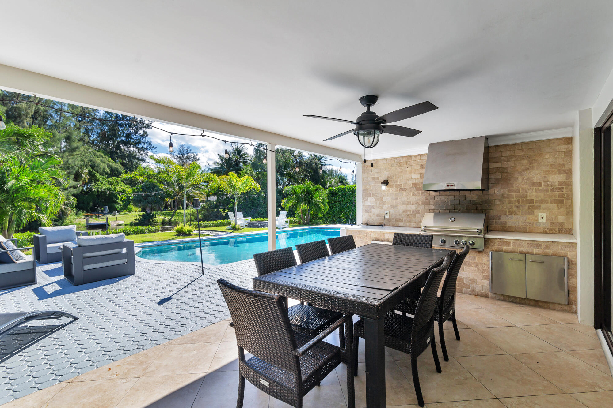 7730 Beta Circle Lake Clarke Shores, FL 33406 - Photo 10 of 50 a view of a dining room with furniture window and wooden floor
