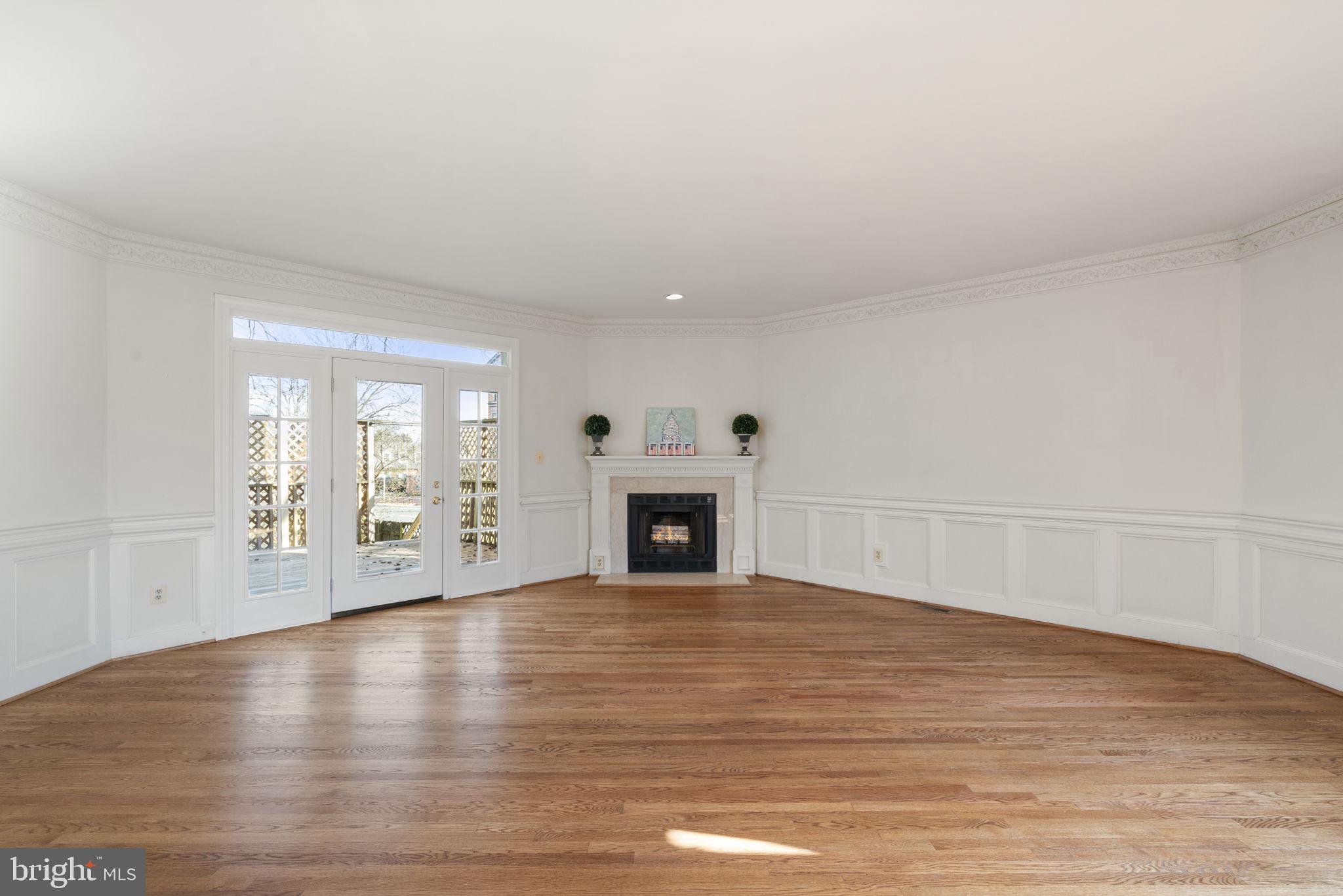 1537 Cedar Avenue McLean, VA 22101 - Photo 12 of 54 a view of a livingroom with wooden floor and a fireplace