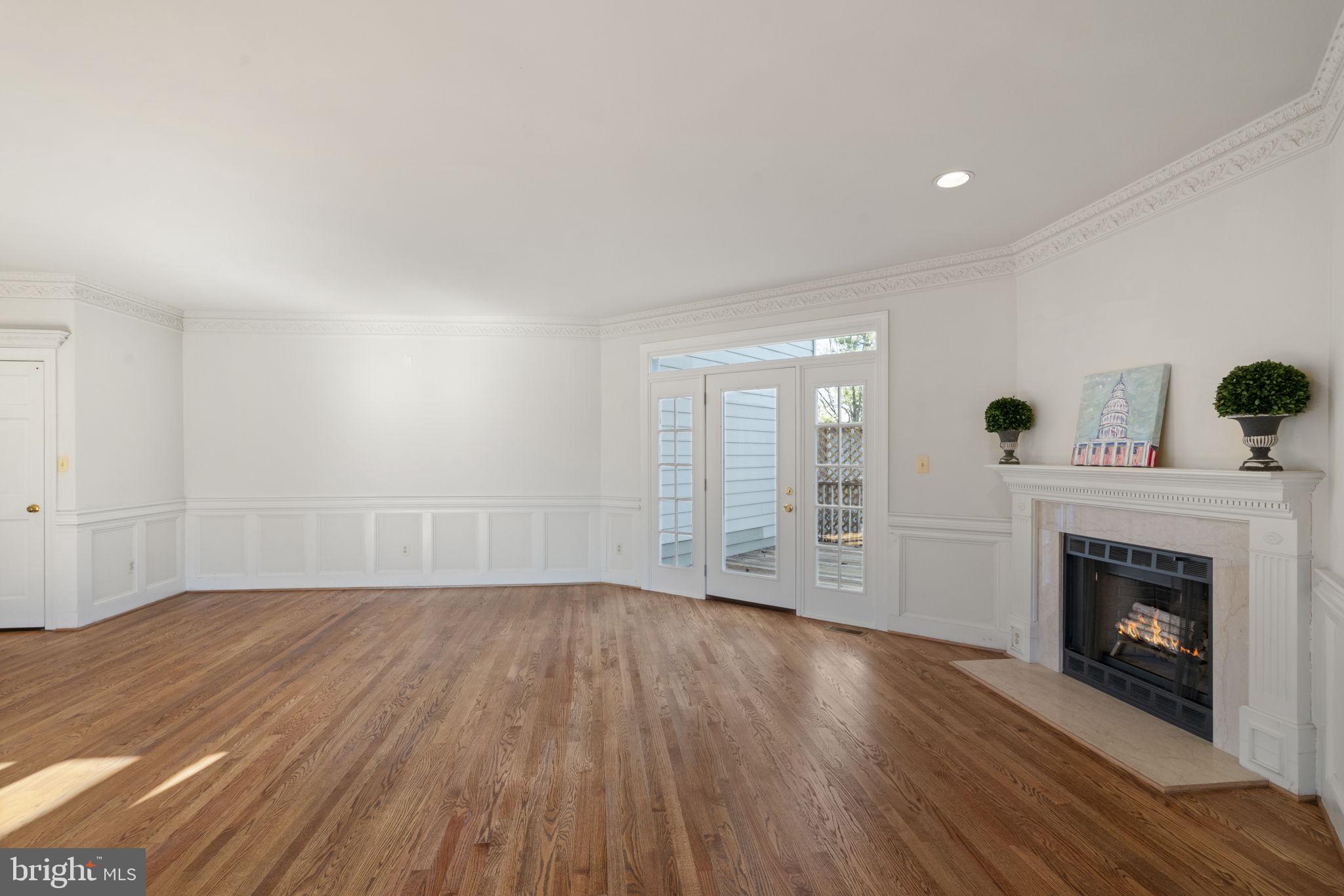 1537 Cedar Avenue McLean, VA 22101 - Photo 13 of 54 a view of empty room with wooden floor and fireplace