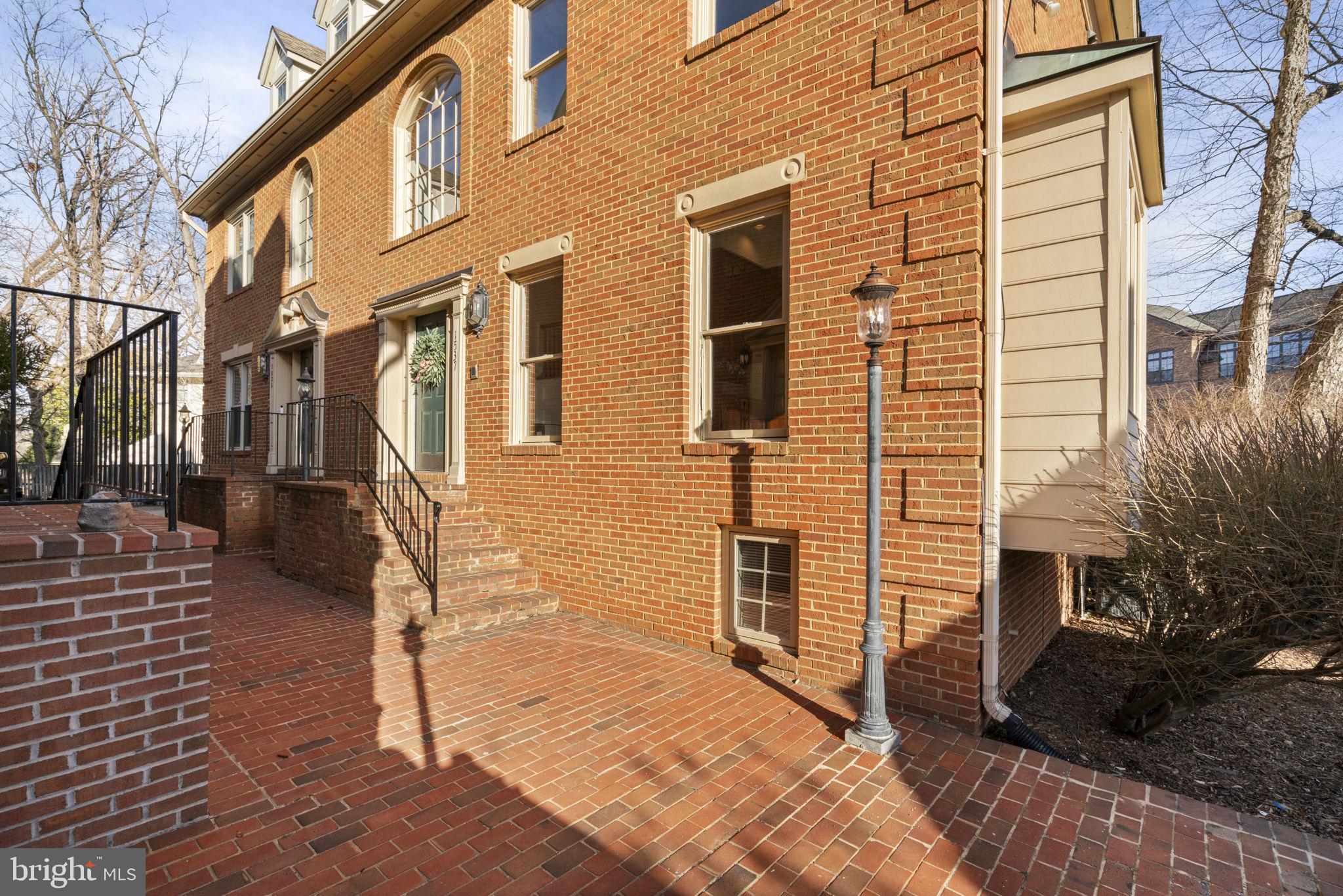 1537 Cedar Avenue McLean, VA 22101 - Photo 2 of 54 a view of a brick house with many windows