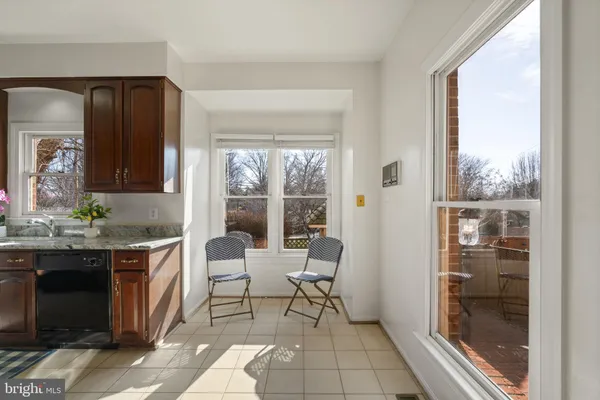 a living room with granite countertop furniture and a fireplace