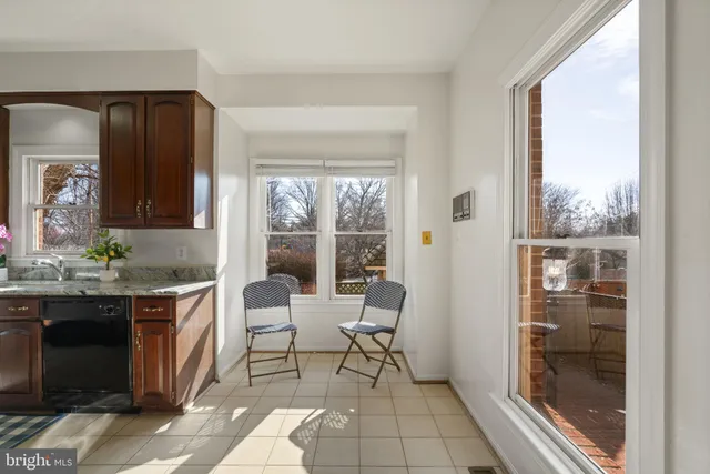 a living room with granite countertop furniture and a fireplace