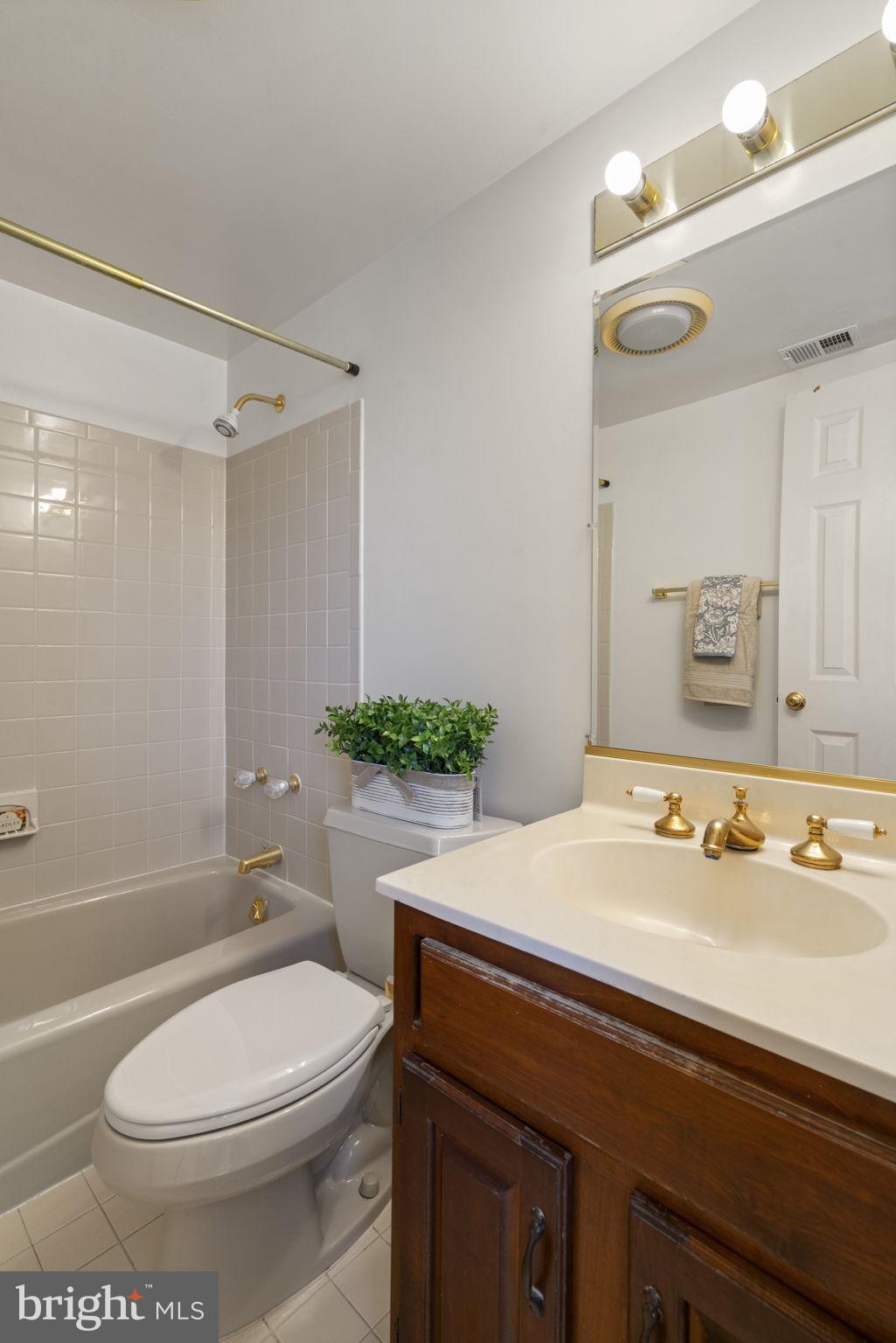 1537 Cedar Avenue McLean, VA 22101 - Photo 26 of 54 a bathroom with a sink a toilet and shower