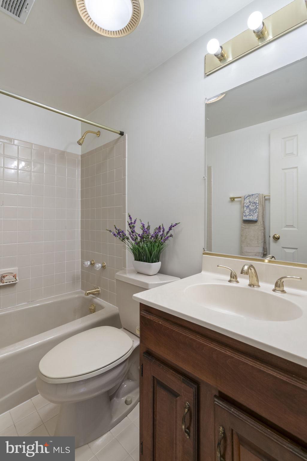 1537 Cedar Avenue McLean, VA 22101 - Photo 30 of 54 a bathroom with a sink a toilet and shower