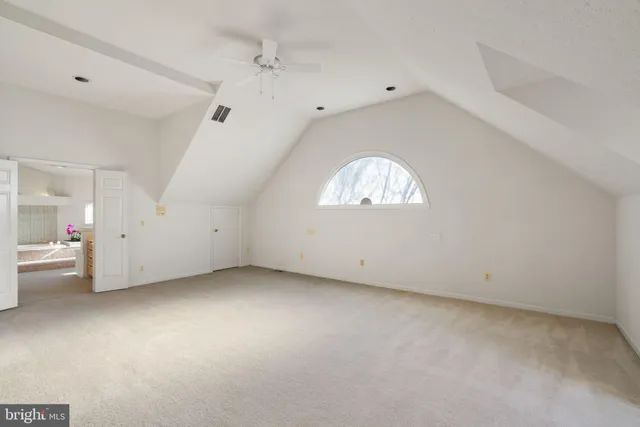 a bathroom with a granite countertop sink and a bathtub
