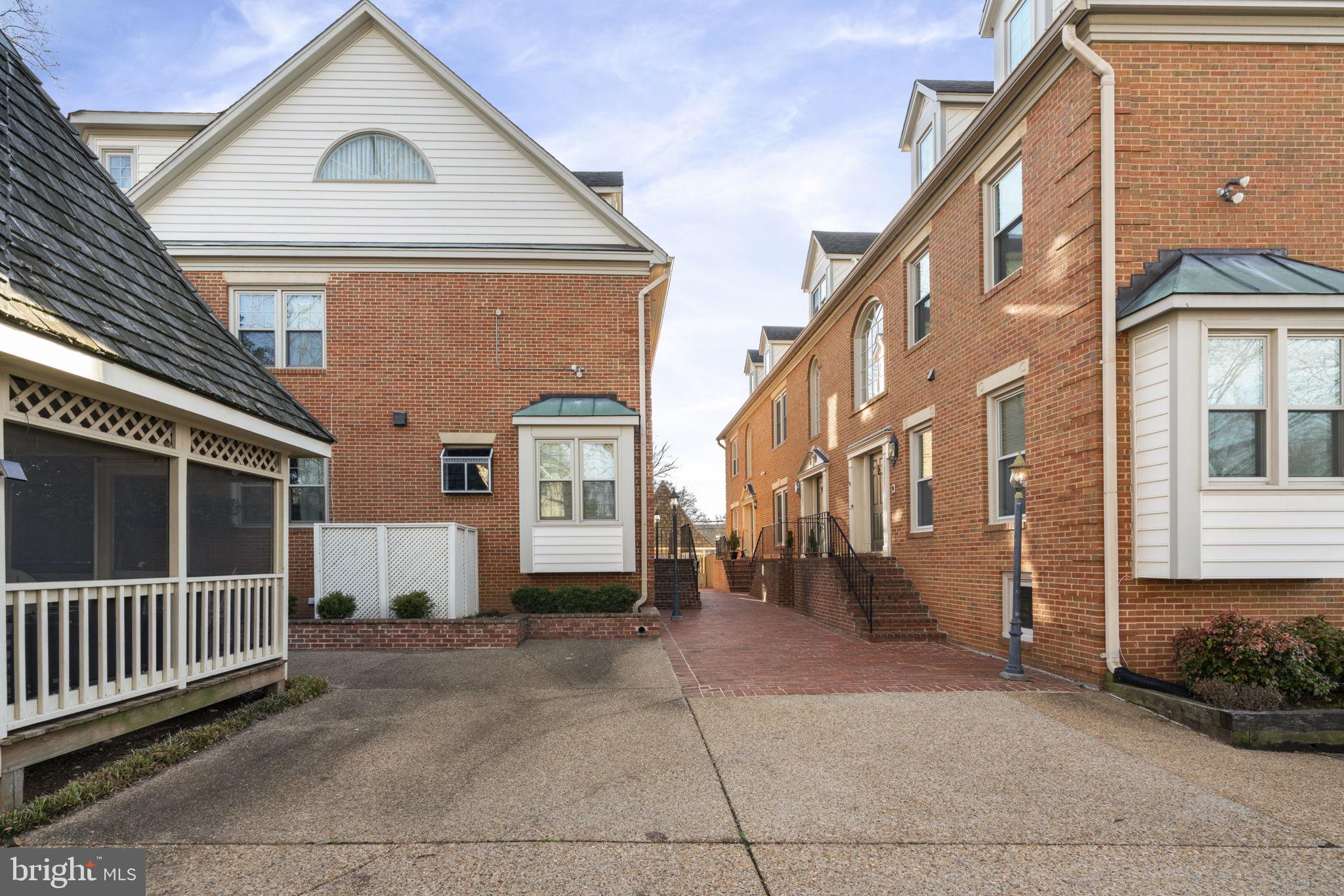1537 Cedar Avenue McLean, VA 22101 - Photo 4 of 54 a view of a brick house with many windows