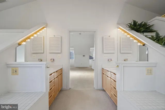 a view of an empty room with a fireplace and a window