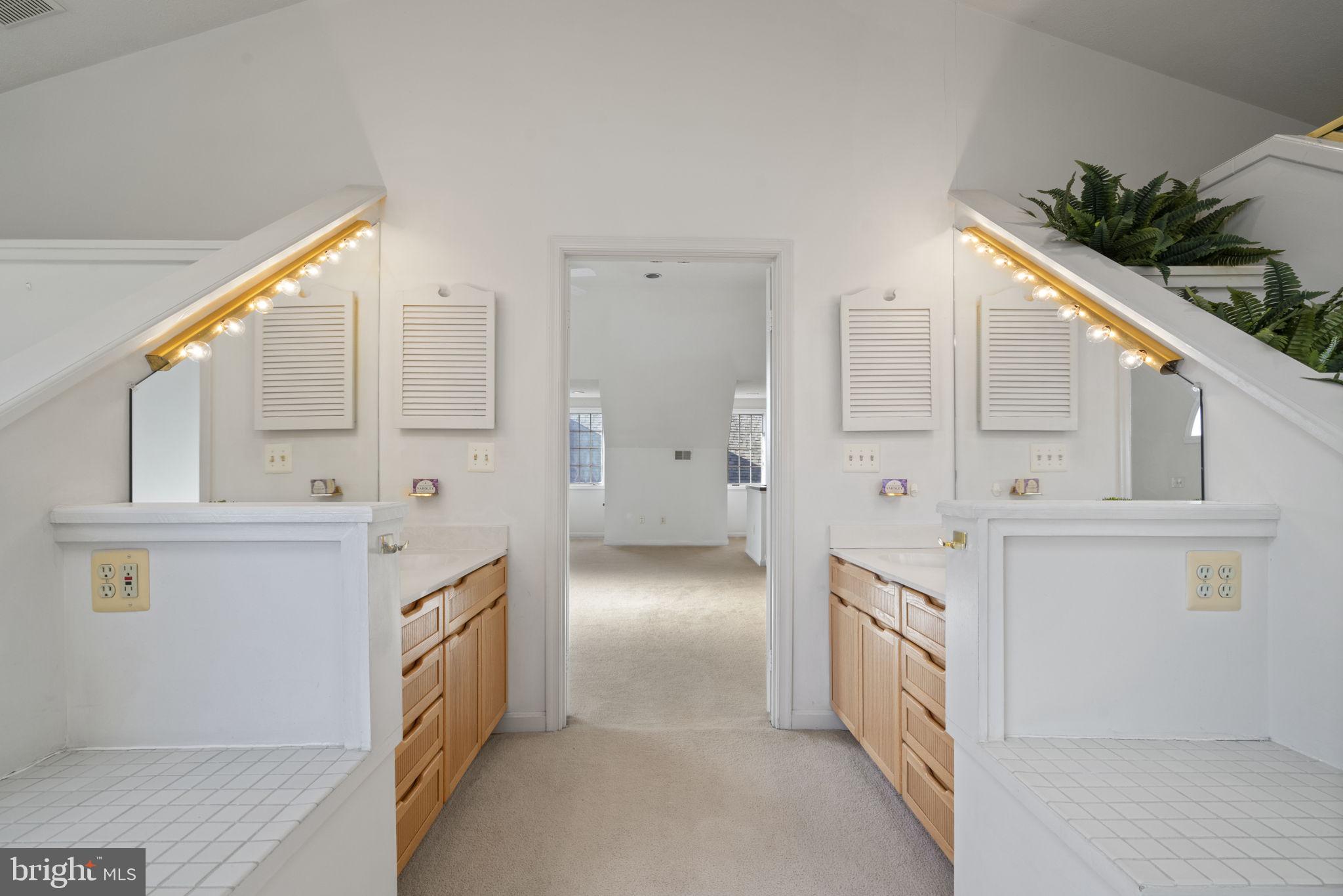 1537 Cedar Avenue McLean, VA 22101 - Photo 42 of 54 a bathroom with a double vanity sink a mirror and shower