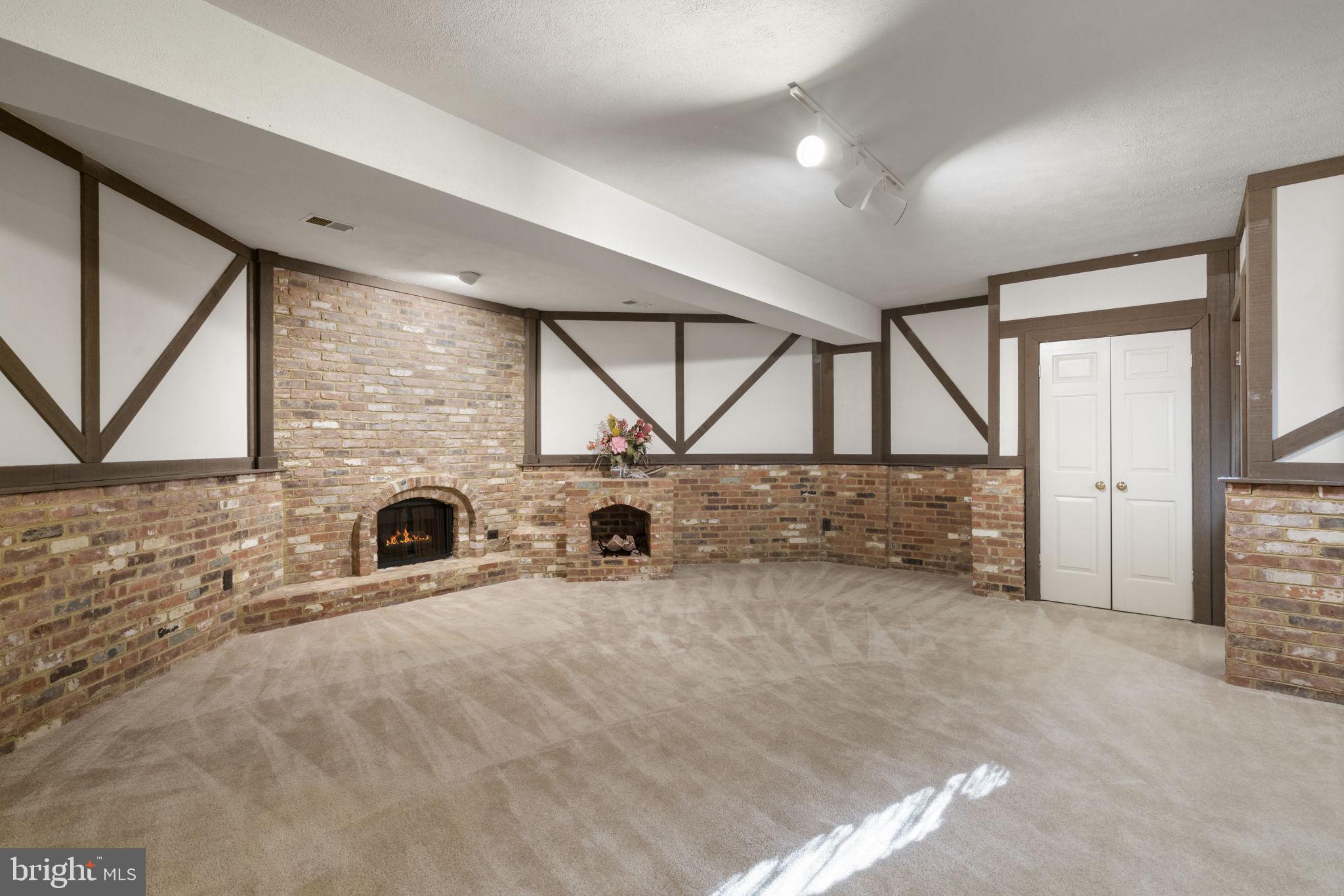 1537 Cedar Avenue McLean, VA 22101 - Photo 45 of 54 a view of an empty room with a fireplace and a window