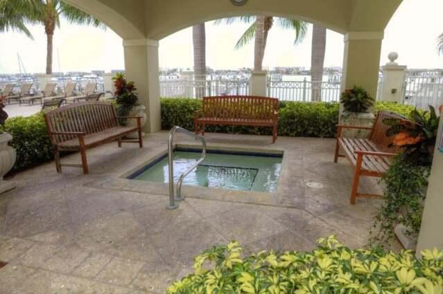 802 West Windward Way, Unit 211 Lantana, FL 33462 - Photo 18 of 32 a roof deck with couches and potted plants