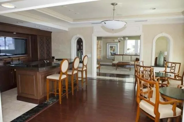 a view of a dining room with furniture and chandelier