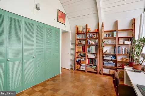 a view of a livingroom with furniture and staircase