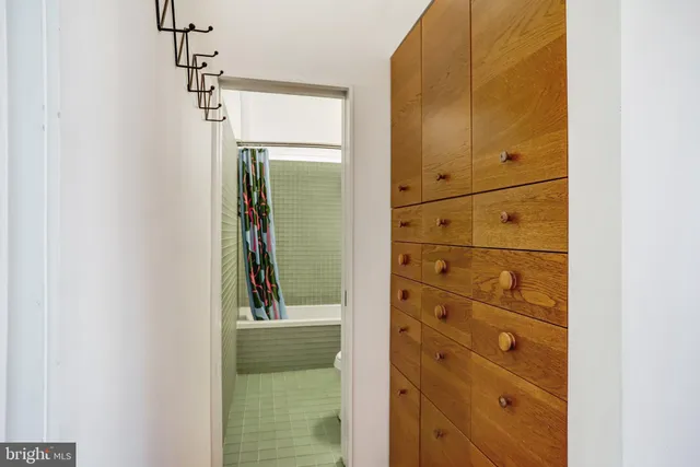 a view of a bathroom from a hallway