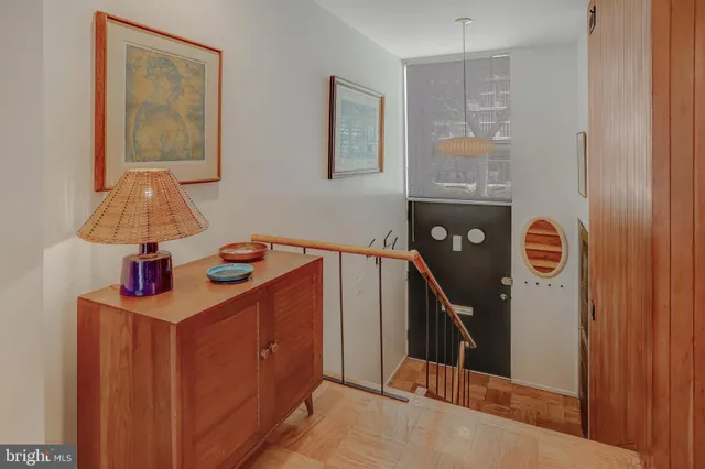 a view of hallway with wooden floor