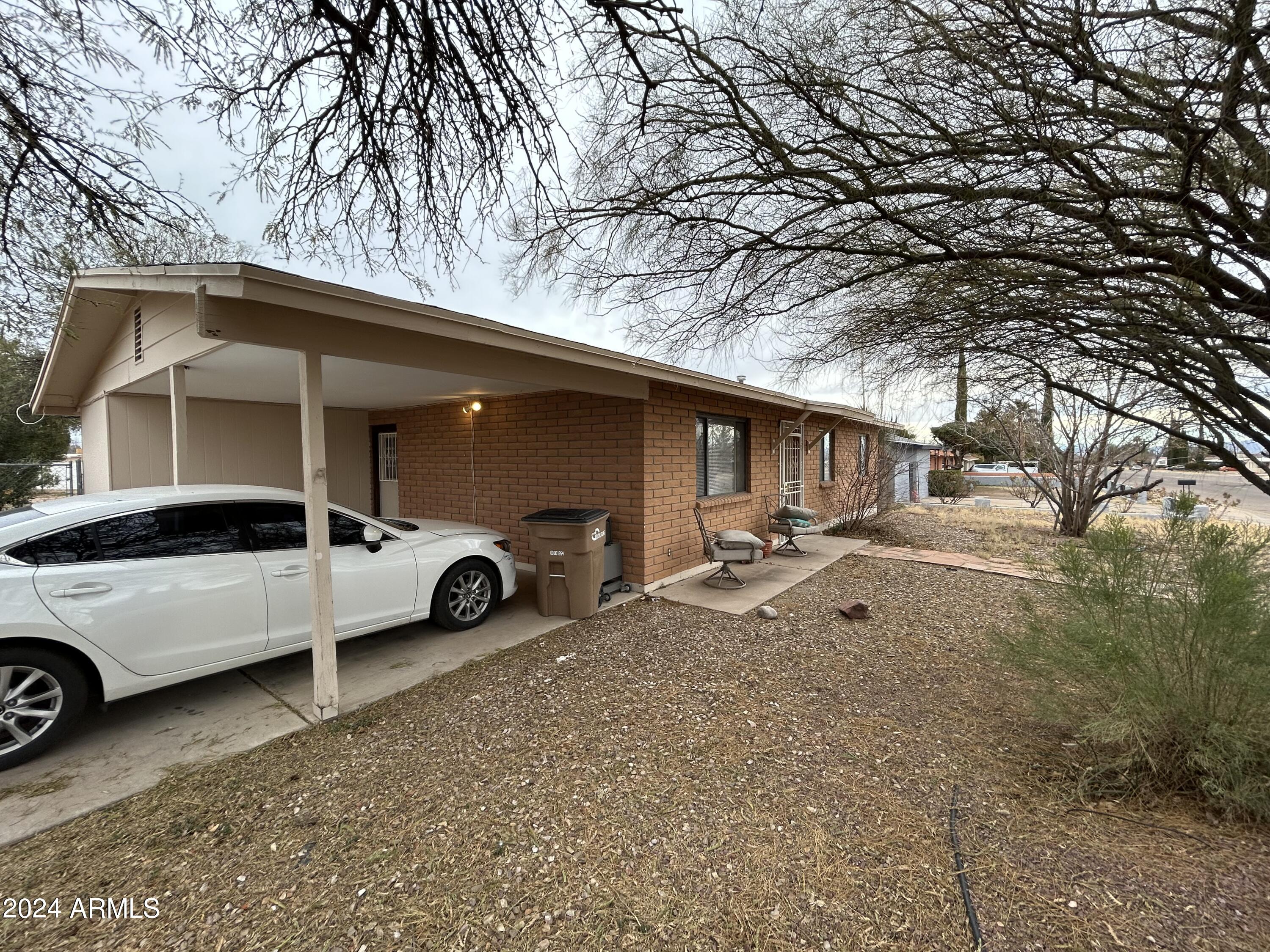 2419 East 10th Street Douglas, AZ 85607 - Photo 1 of 21 a view of a car in front of house
