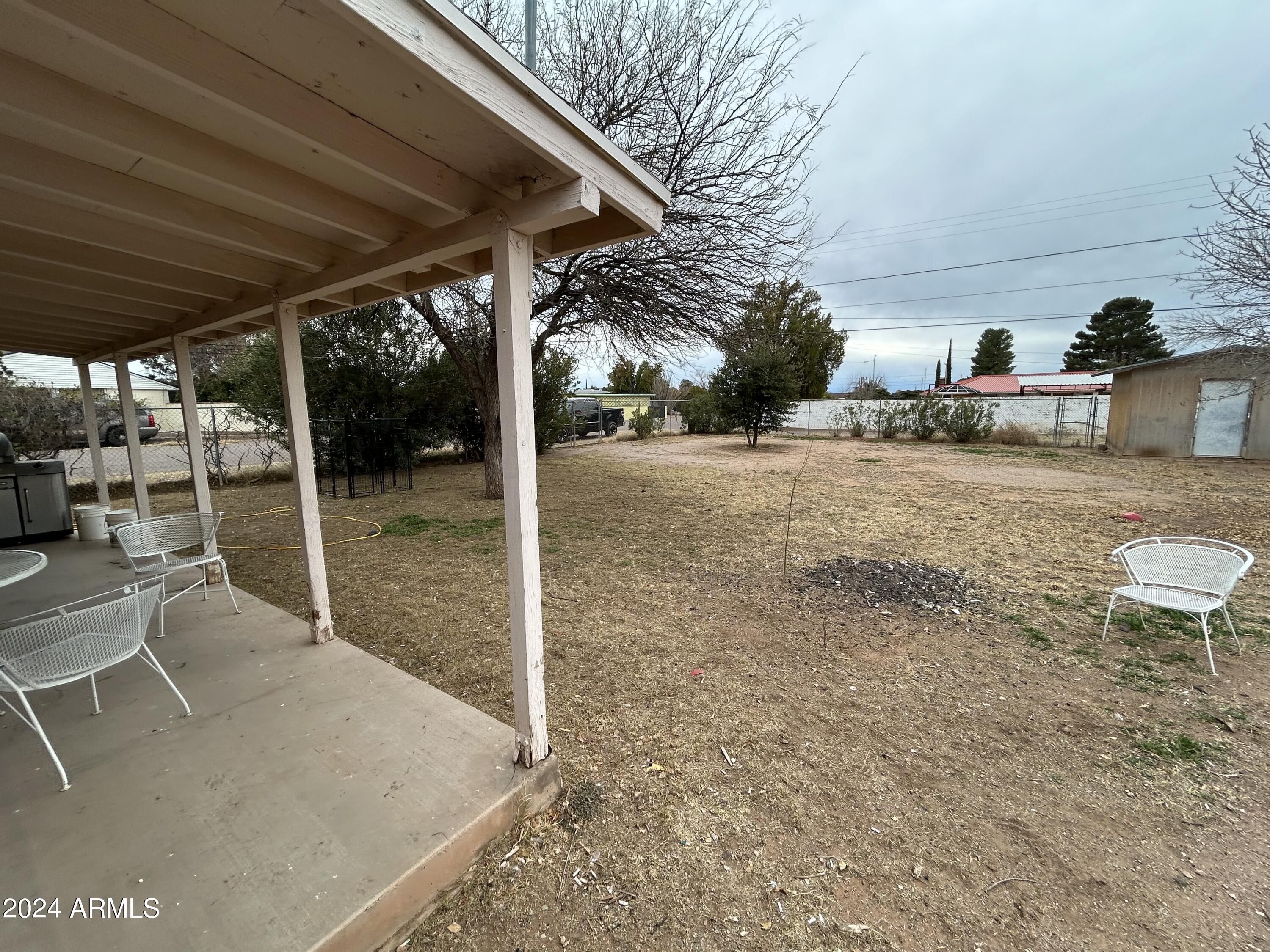 2419 East 10th Street Douglas, AZ 85607 - Photo 12 of 21 a view of a patio with table and chairs and potted plants