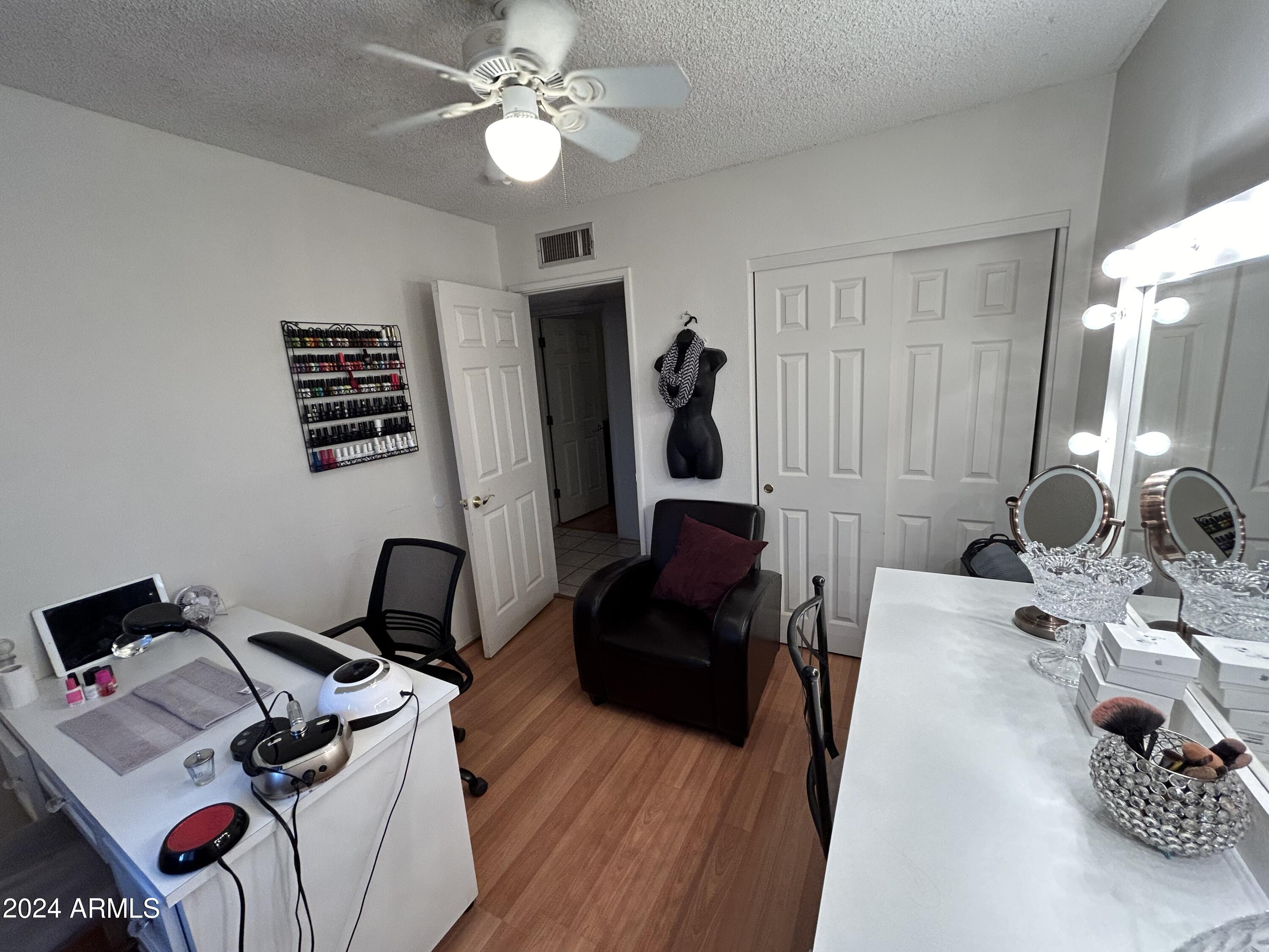 2419 East 10th Street Douglas, AZ 85607 - Photo 20 of 21 a living room with furniture and a flat screen tv