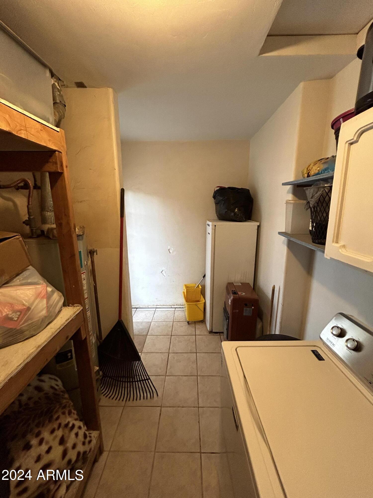 2419 East 10th Street Douglas, AZ 85607 - Photo 7 of 21 a bed room with a bed and a couch