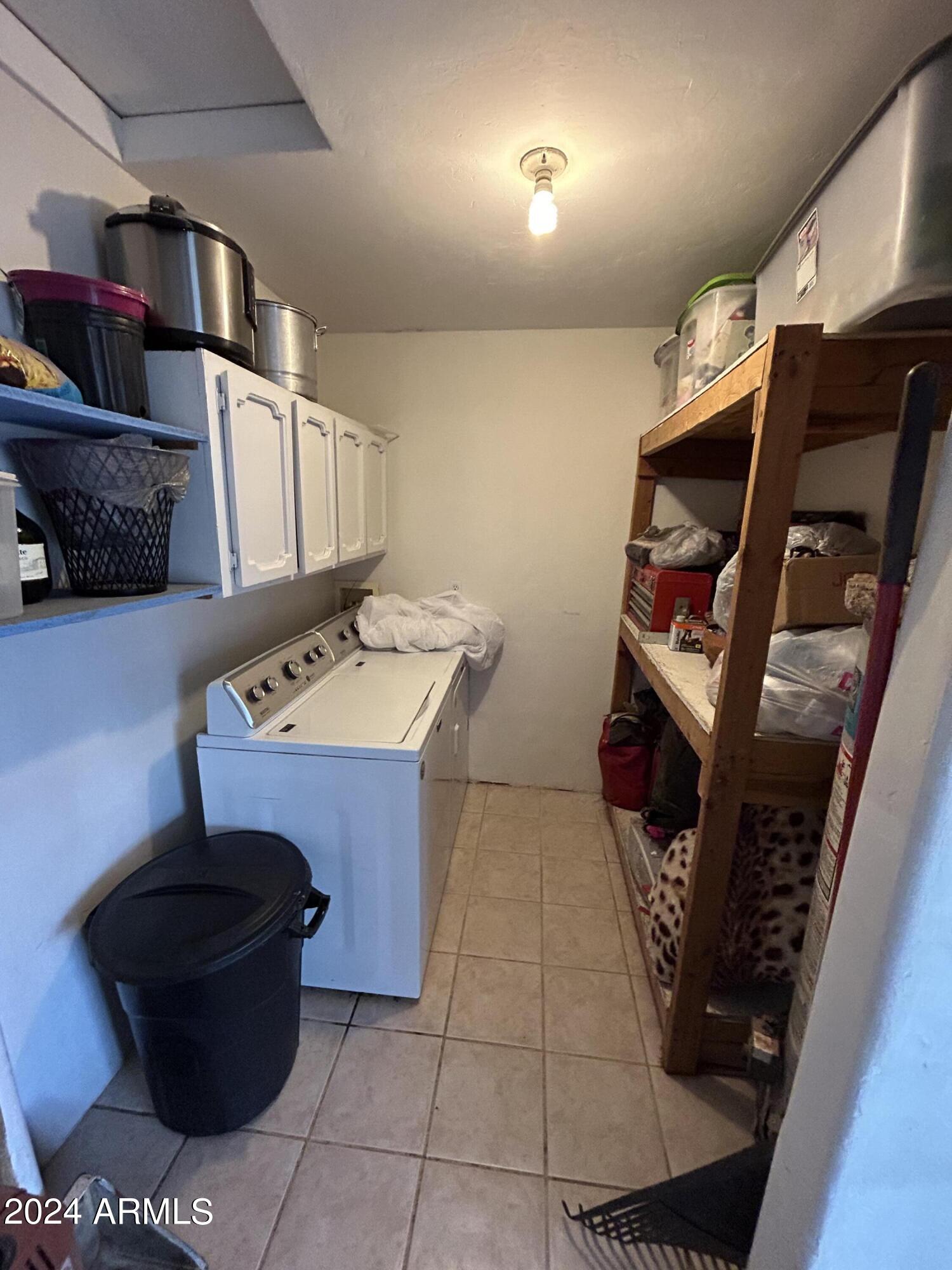 2419 East 10th Street Douglas, AZ 85607 - Photo 8 of 21 a kitchen with a stove and a refrigerator
