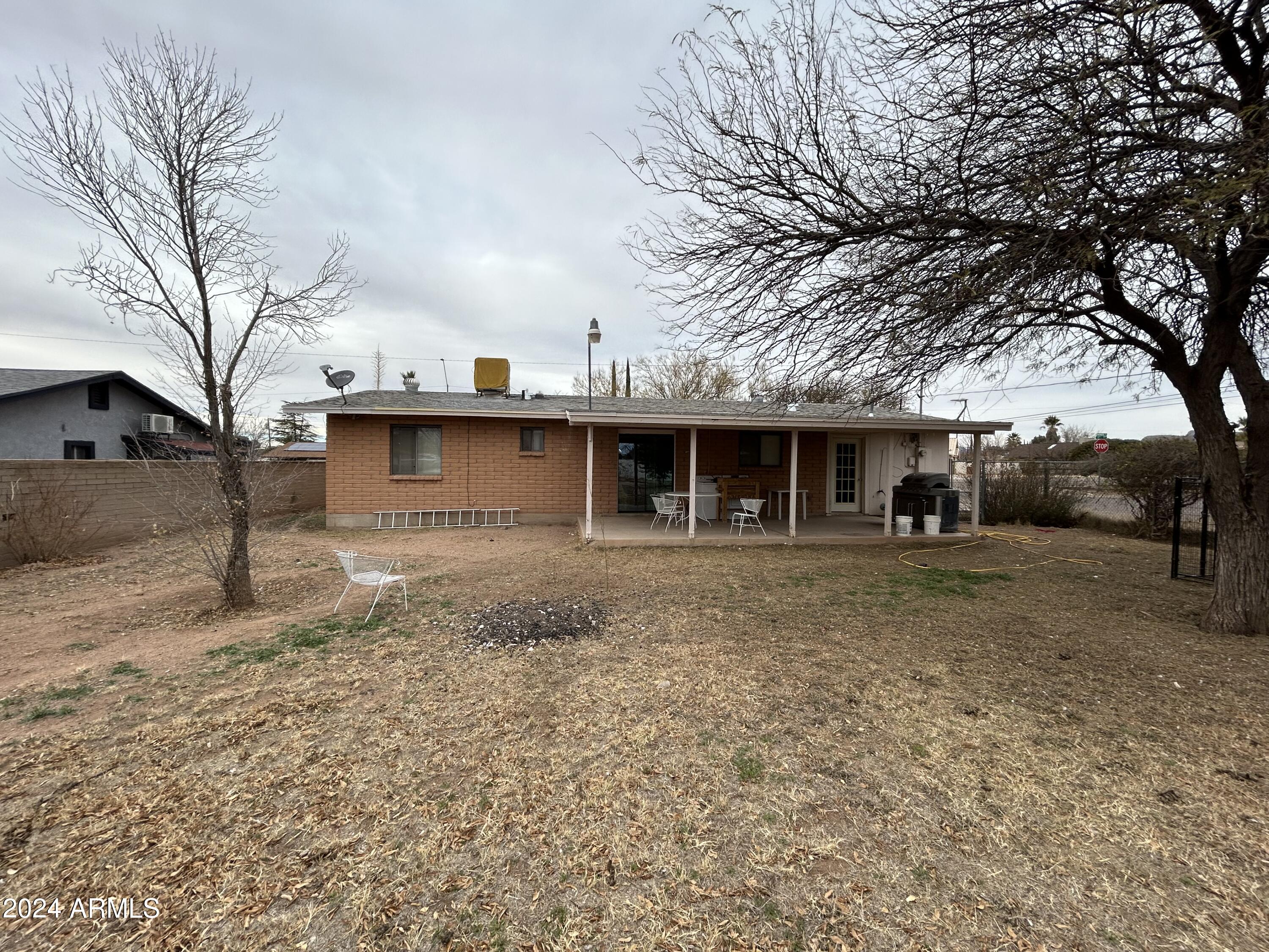 2419 East 10th Street Douglas, AZ 85607 - Photo 10 of 21 a view of a house with a yard covered in snow