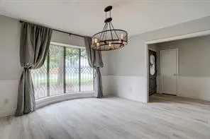 a view of entryway with wooden floor