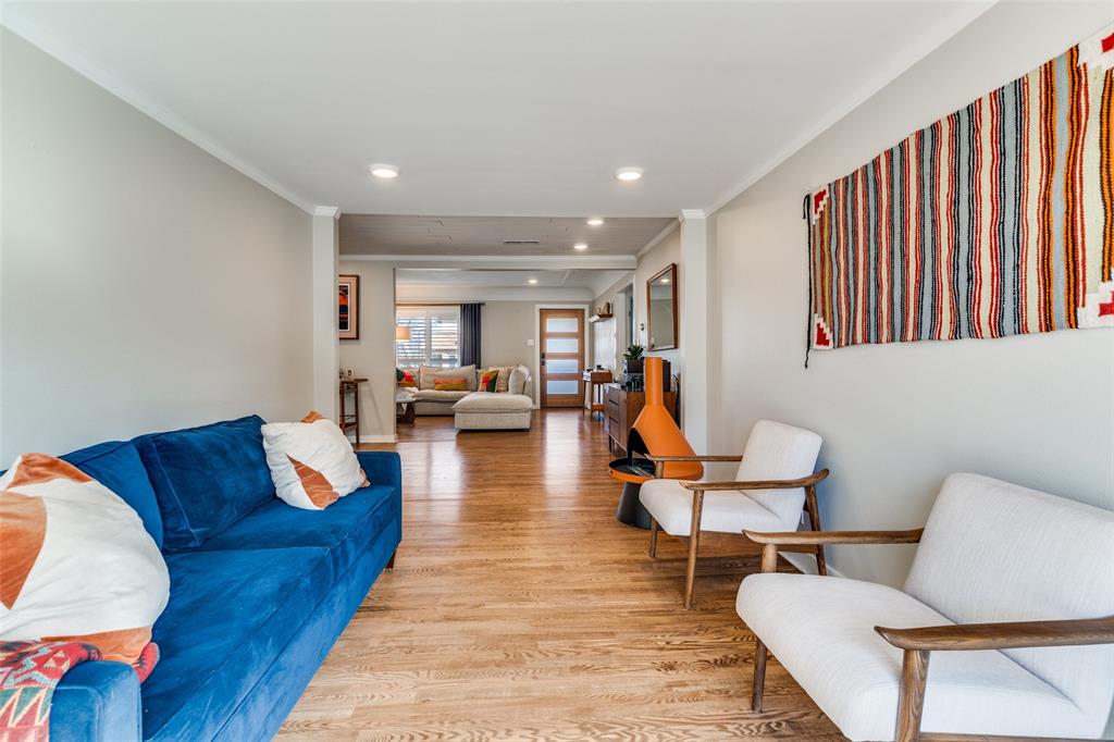 4245 Concho Street Dallas, TX 75206 - Photo 15 of 30 Living room featuring light wood-type flooring, ornamental molding, and recessed lighting
