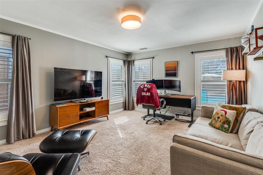 4245 Concho Street Dallas, TX 75206 - Photo 16 of 30 3rd bedroom being used as home office featuring light carpet and healthy amount of natural light