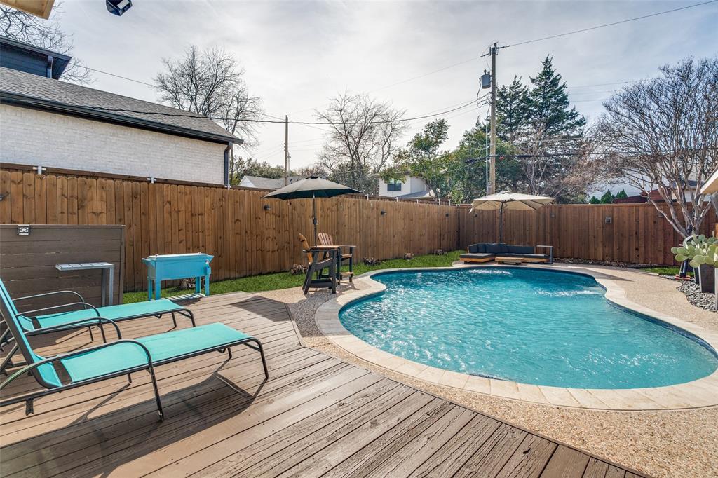 4245 Concho Street Dallas, TX 75206 - Photo 21 of 30 View of pool featuring a fenced backyard and a wooden deck