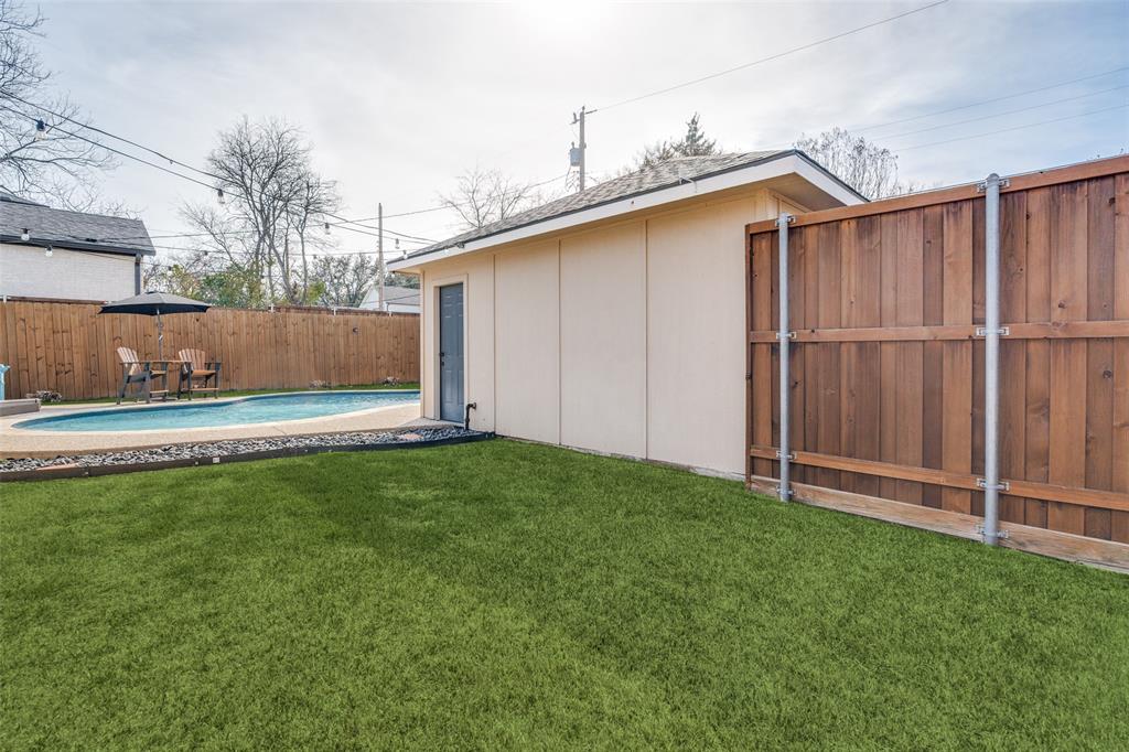 4245 Concho Street Dallas, TX 75206 - Photo 23 of 30 Fenced yard with a patio area