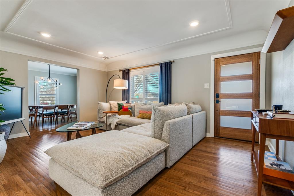 4245 Concho Street Dallas, TX 75206 - Photo 6 of 30 Living area with wood-type flooring and a chandelier