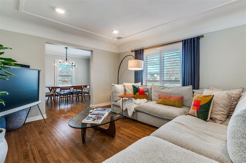 4245 Concho Street Dallas, TX 75206 - Photo 8 of 30 Living area with dark wood finished floors, crown molding, and recessed lighting