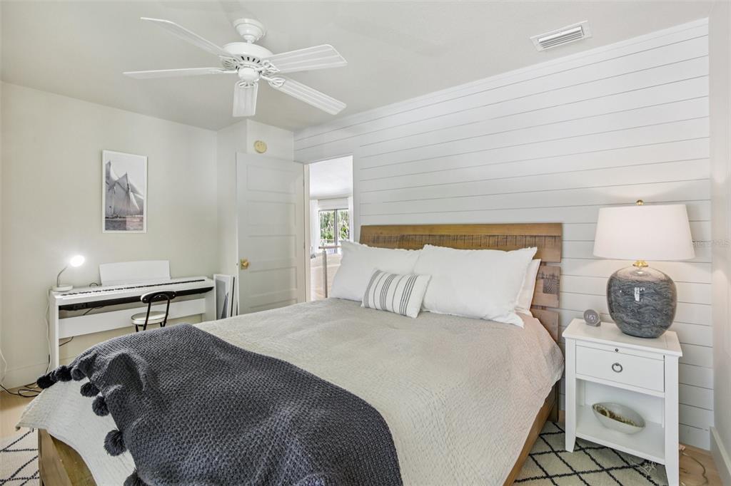 3390 Bayou Sound Longboat Key, FL 34228 - Photo 36 of 59 a bedroom with a bed and a chandelier