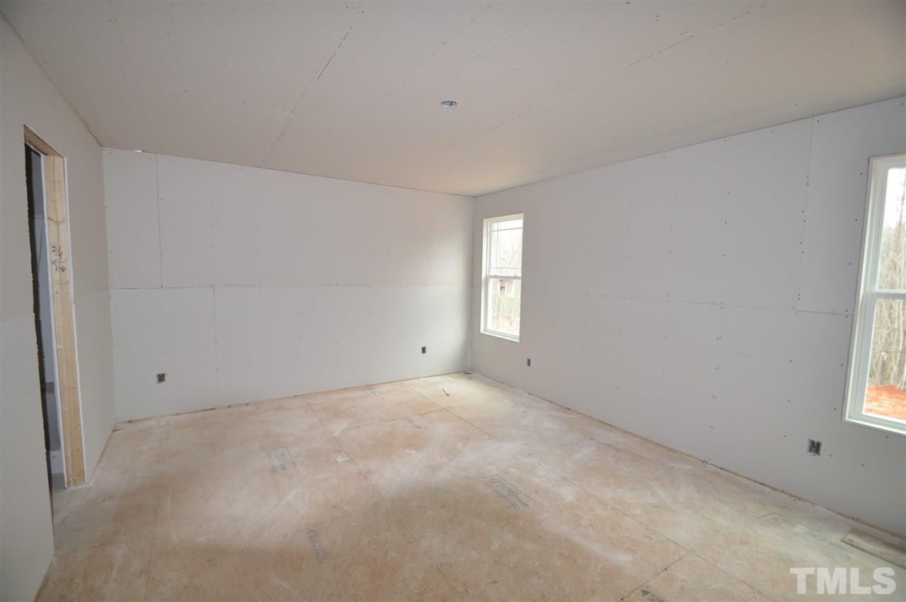 20 Mullins Pond Rd Spring Spring Hope, NC 27882 - Photo 3 of 6 a view of an empty room with a window