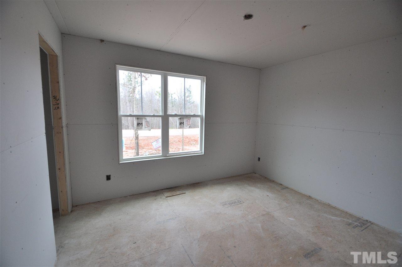 20 Mullins Pond Rd Spring Spring Hope, NC 27882 - Photo 4 of 6 a view of an empty room with a window