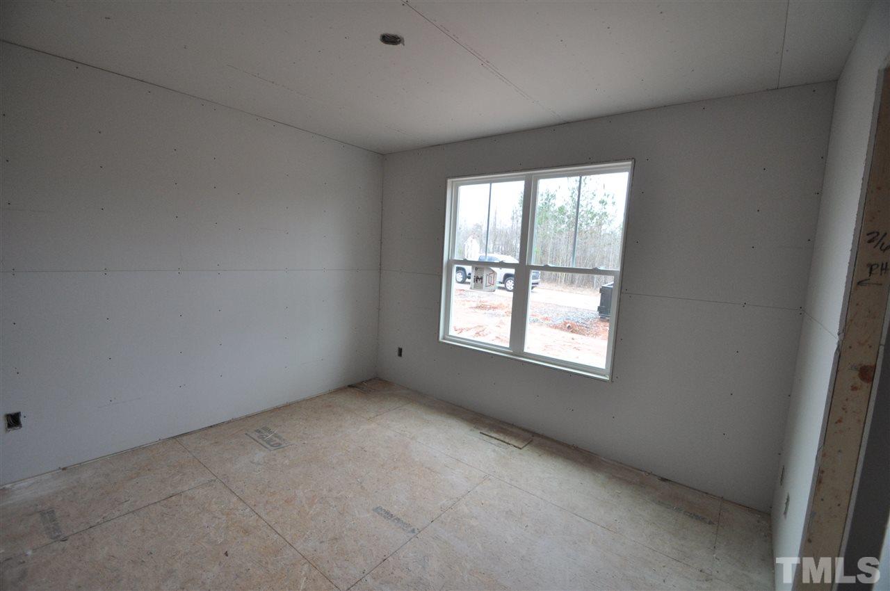 20 Mullins Pond Rd Spring Spring Hope, NC 27882 - Photo 5 of 6 an empty room with a window